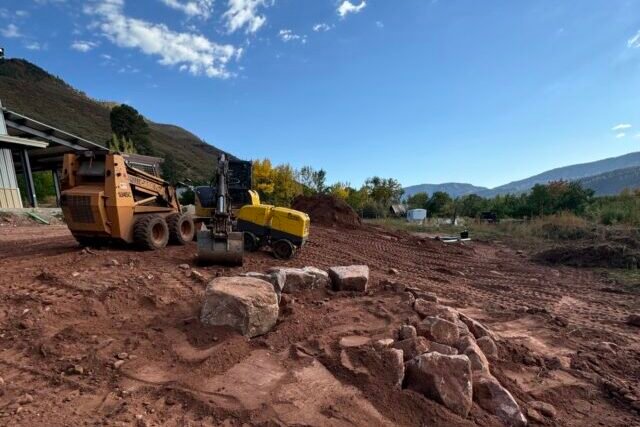 a construction equipment on a dirt field